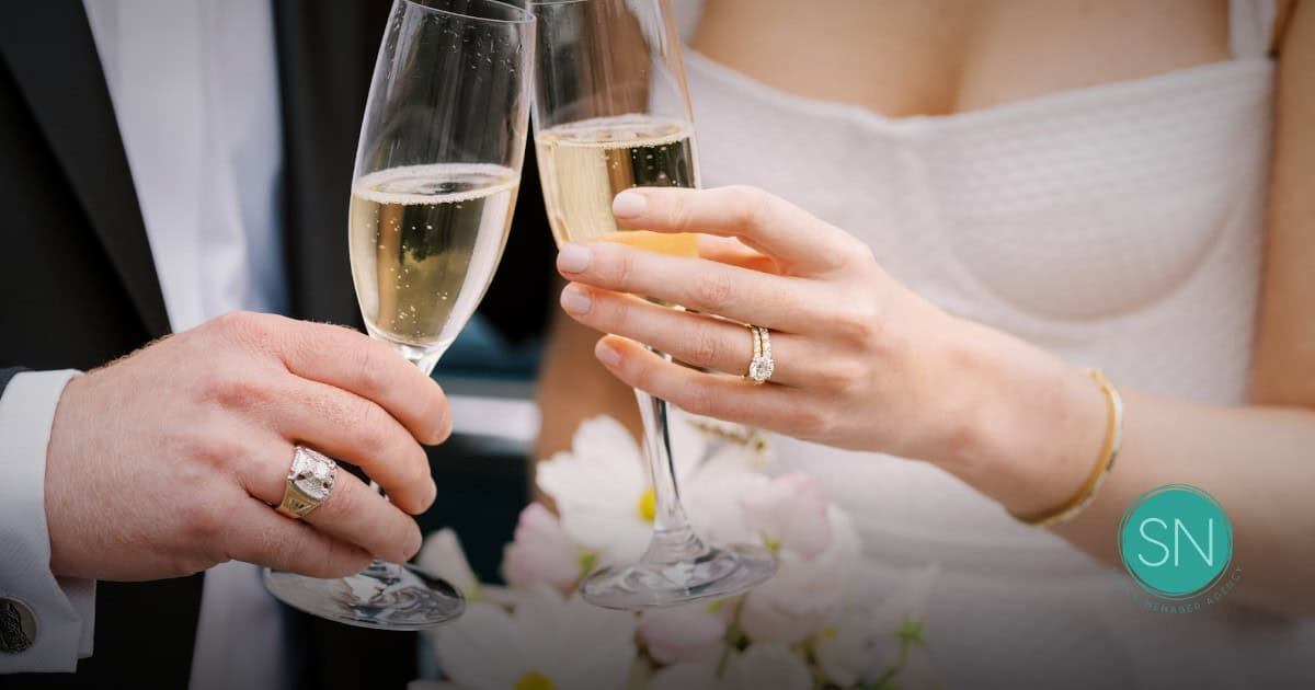 Celebrating Life Events with Champagne Couple toasting with champagne glasses during a wedding celebration.